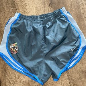 Grey and blue Nike shorts; size M